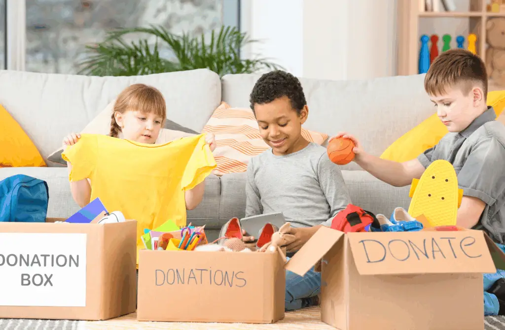 Kids packing a box for donations